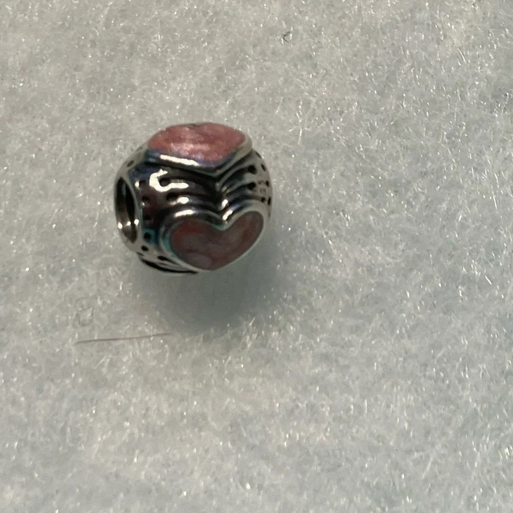 EUC Pandora Rose Enamel Hearts Charm Retired. In excellent condition.